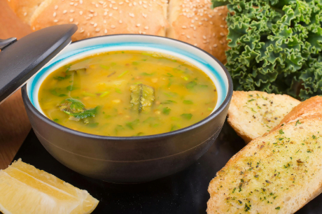 bowl of zuppa toscana with sausage, kale and potato