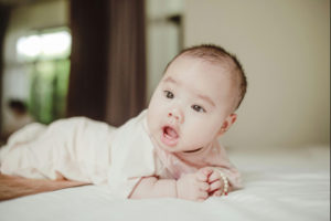 newborn enjoying tummy time